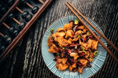 Chicken meals are served in Mott 32 at Paradox Hotel Vancouver
