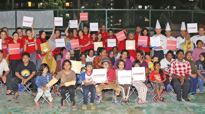 Group of kids holding SUNWAY boards & posing at Sunway Lagoon
