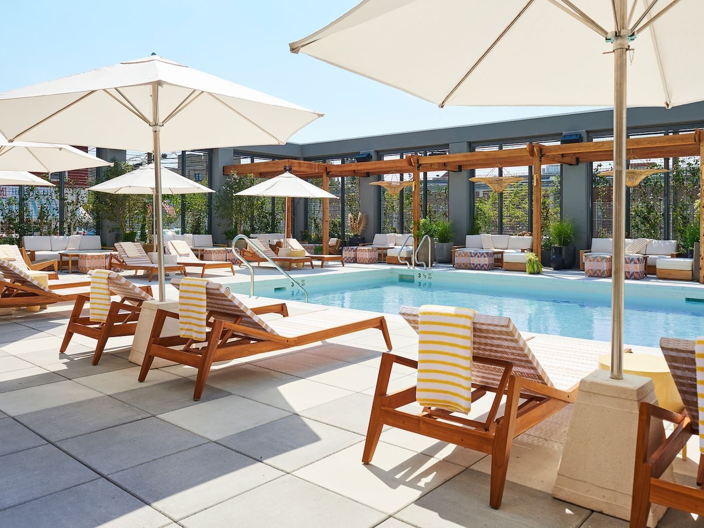 Sunbeds near Poolside Lounge at The Rockaway Hotel