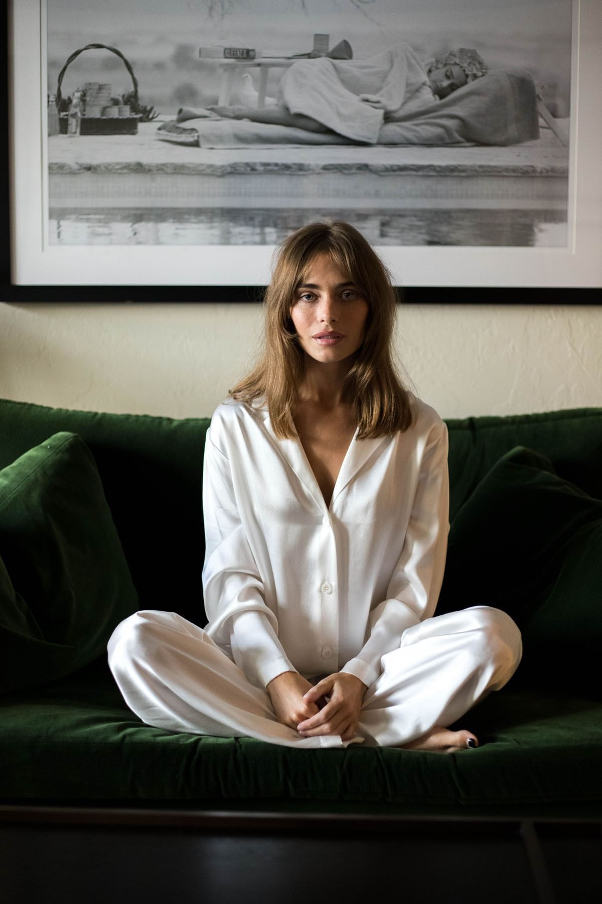 A woman sitting on a chair at Brazilian Court 