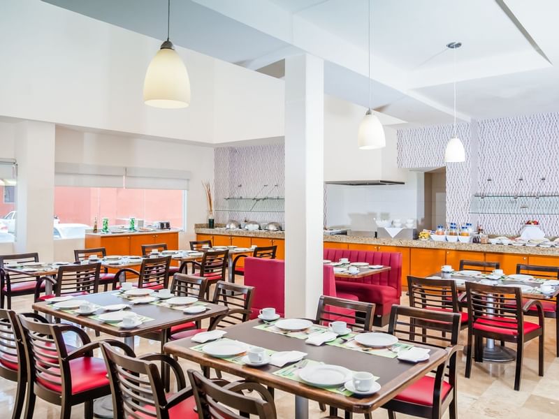 Interior view with cutlery, chairs, tables at Fiesta Inn Hotels