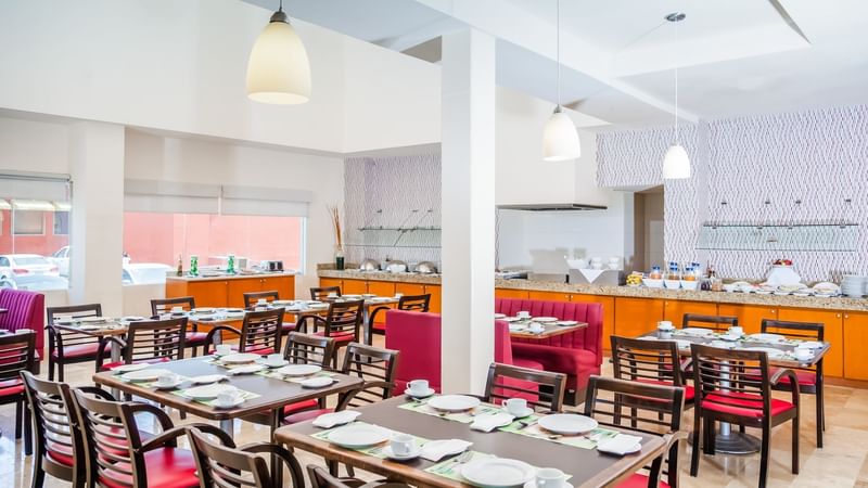 Dining tables set-up in a Restaurant at Fiesta Inn Hotels