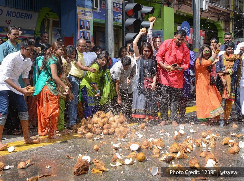 All Malaysians come together and celebrate Thaipusam by smashing coconut.