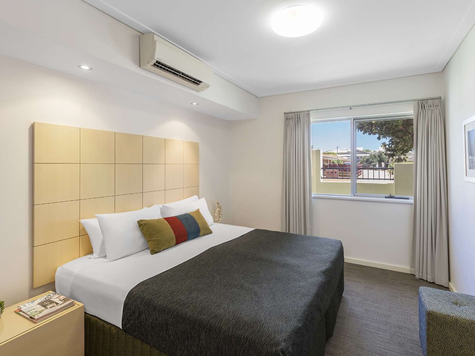 Bed with headboard in 3-Bedroom Apartment at Nesuto Geraldton