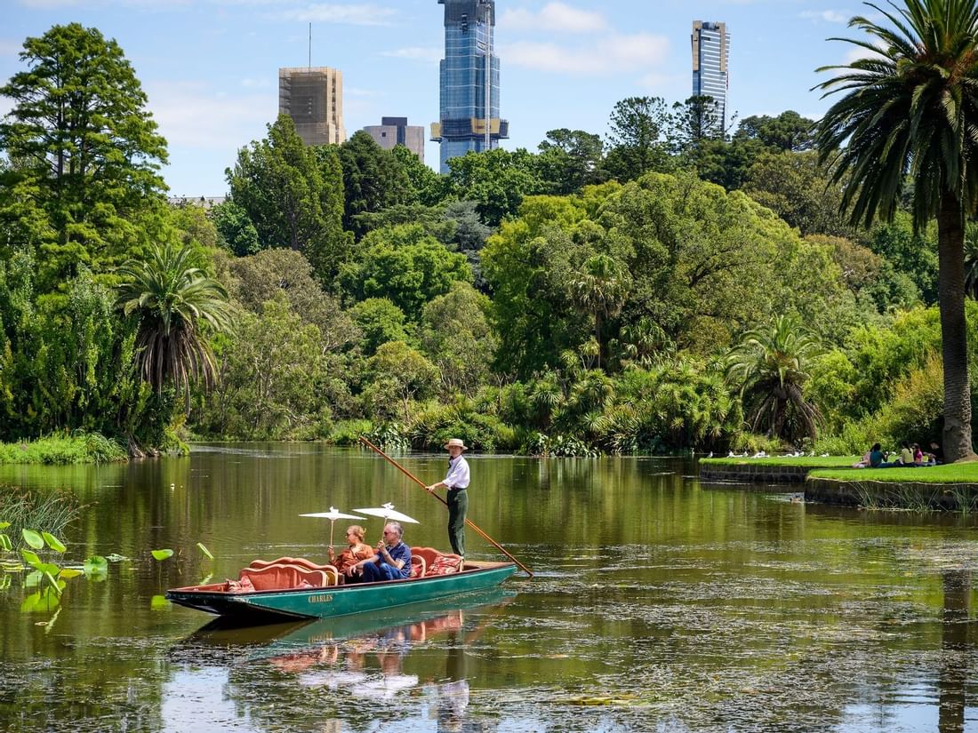 Couple experiencing a boat ride in Royal Botanic Gardens near Quay West Suites Melbourne