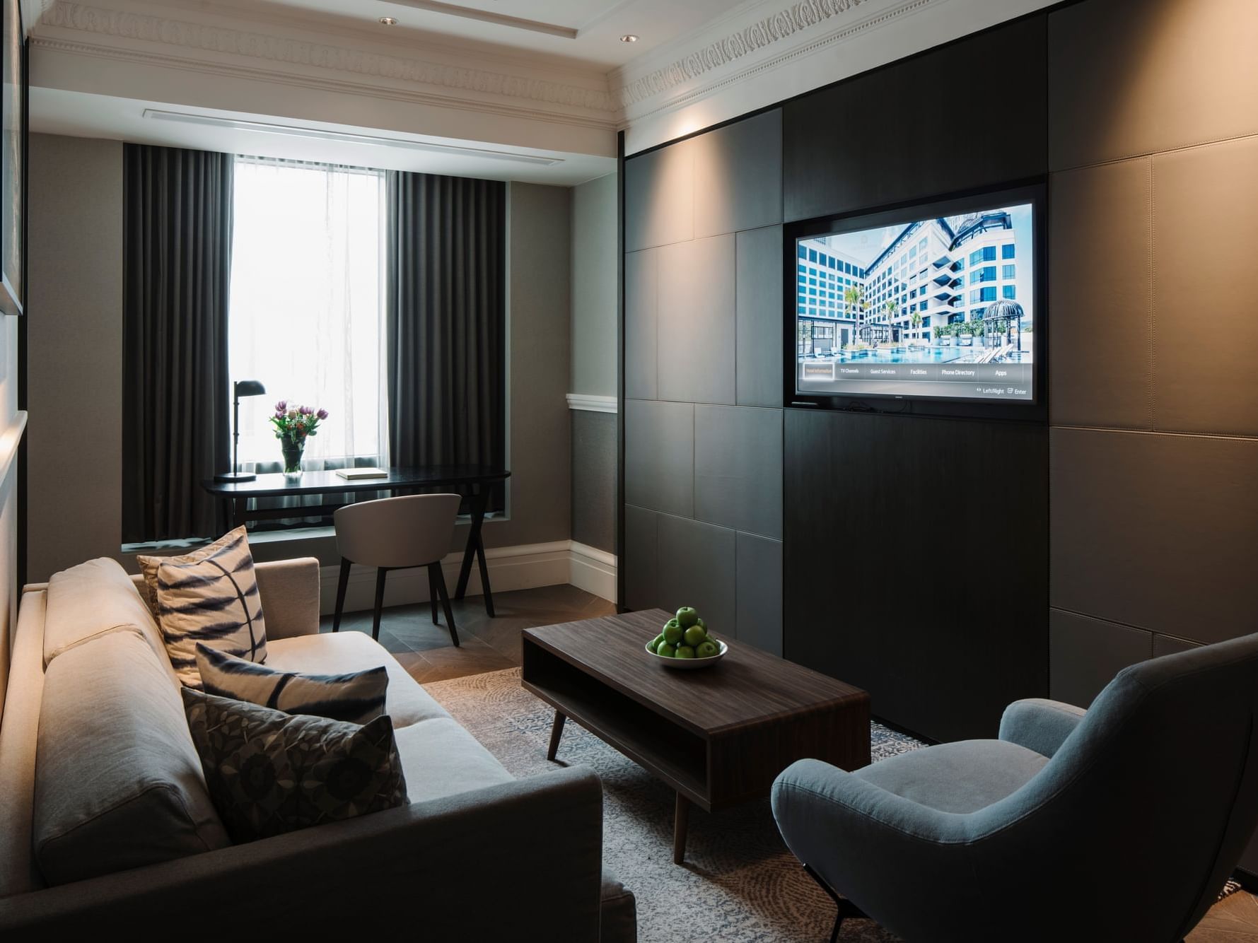 Work desk by the TV lounge area in Coleman Suite at Grand Park City Hall