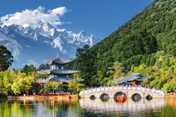 Hei Long Tan by a lake with a bridge   at Park Hotel Group