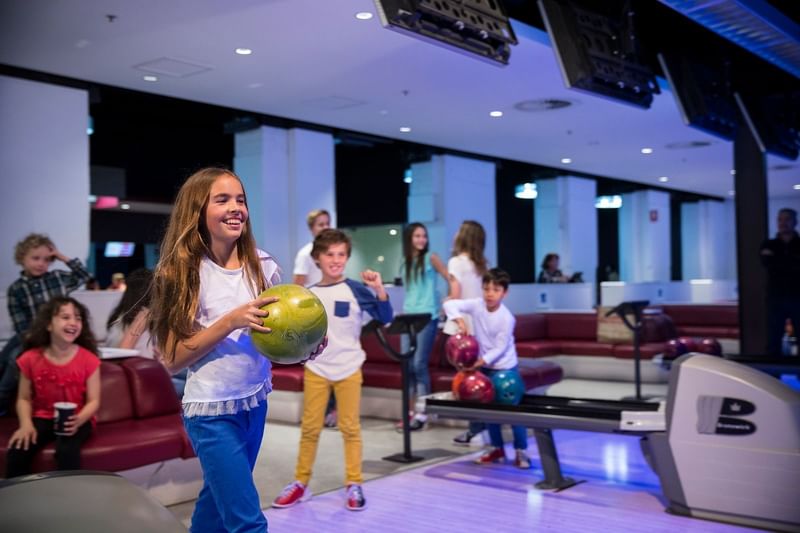 Close up on Kids bowling in the play area at Novotel Sydney