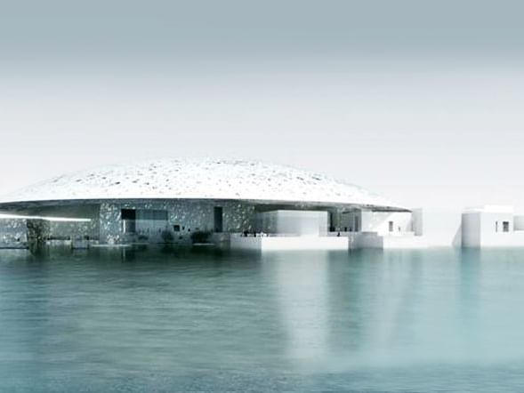 Louvre with a dome-like roof, partially submerged in water near DAMAC Hotels & Resorts, One of the best family hotels in Dubai