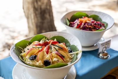 Creamy salad bowls served in an outdoor buffet area at Hotel Isla Del Encanto