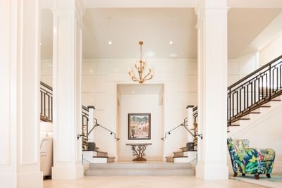 Interior of the lobby lounge area with the stair cases to the balcony at Hotel Atwater