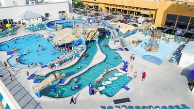 High-angle view of the expansive pool deck and water park slides at Margaritaville Resort Biloxi