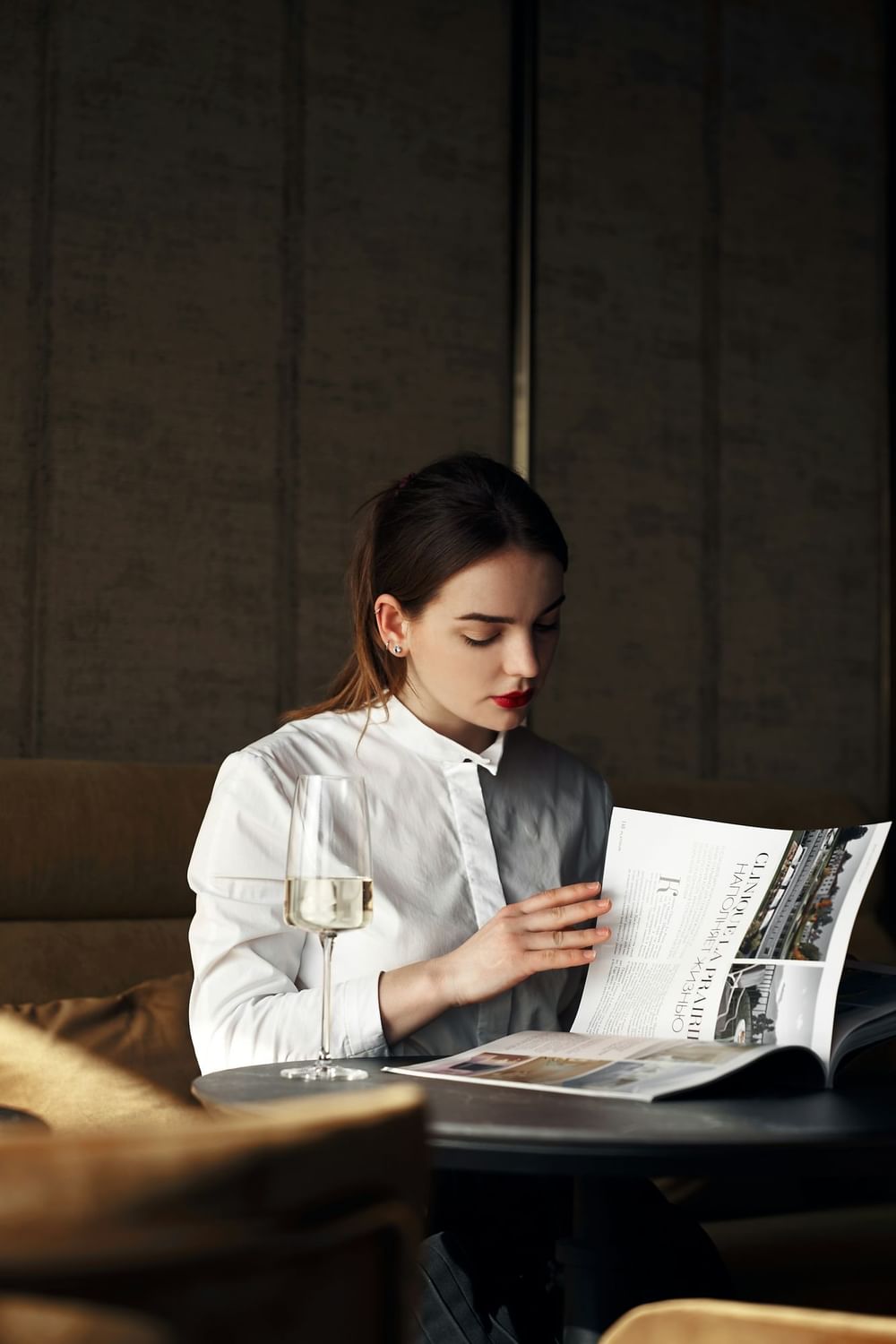 a girl reading a magazine