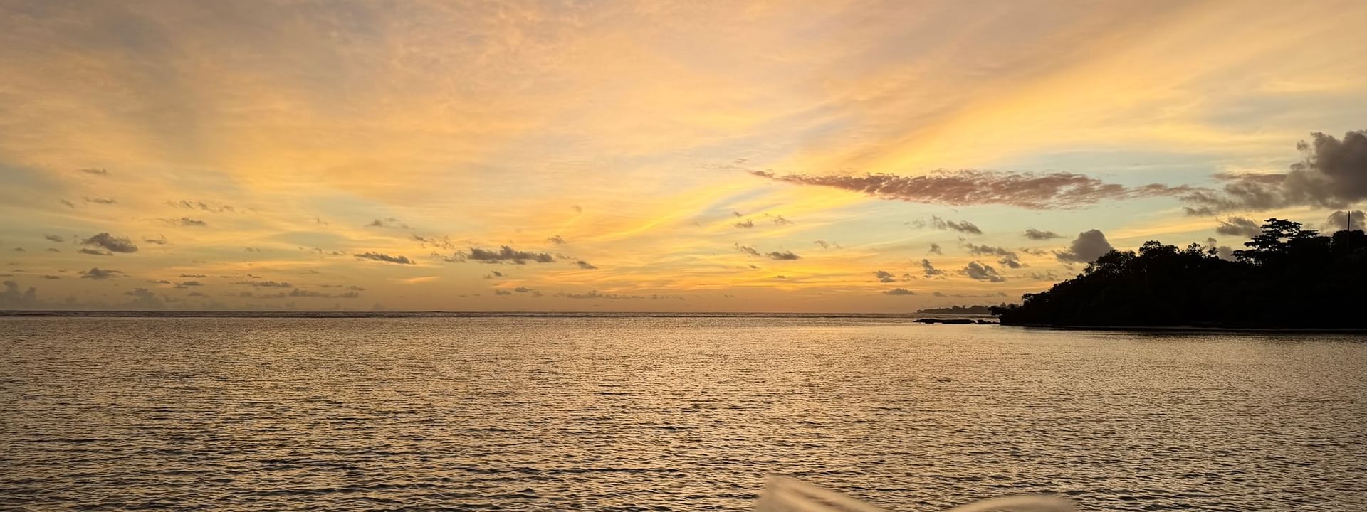 Two glasses of champagne at sunset over the ocean at Warwick Le Lagon - Vanuatu, Efate