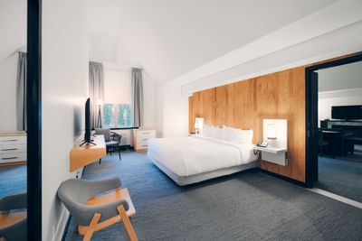 King bed, TV & loungers in Superior King at Aava Whistler Hotel