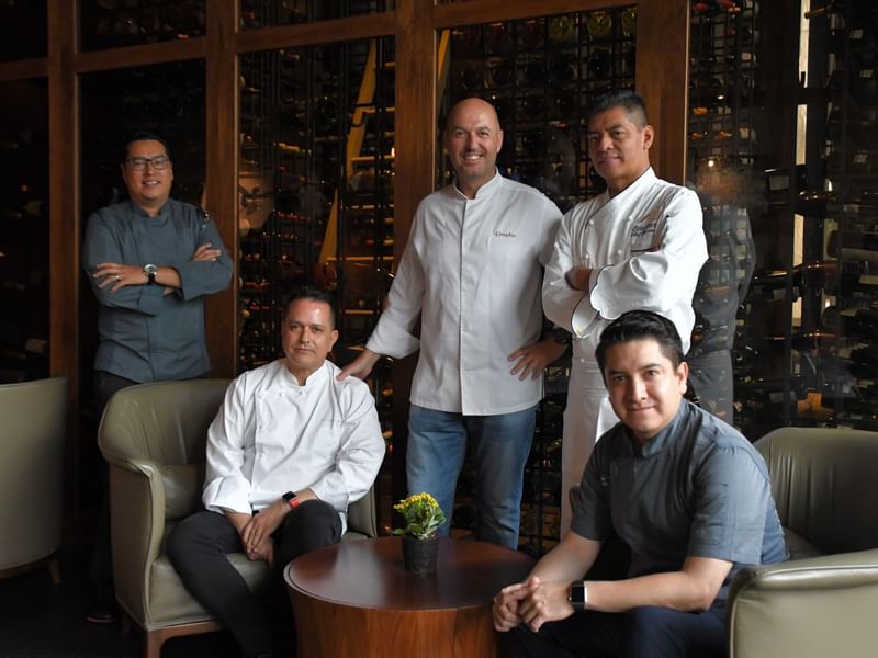 A group of Chefs posing in the Live Seasonal Kitchen at Live Aqua Resorts and Residence Club