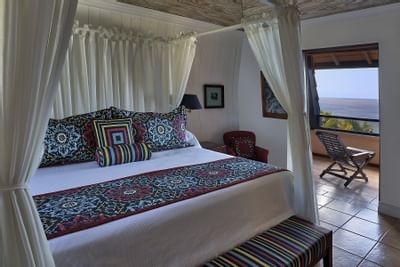 King-size canopy bed with Trinidad ocean view