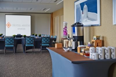 a coffee station in the back of a meeting room