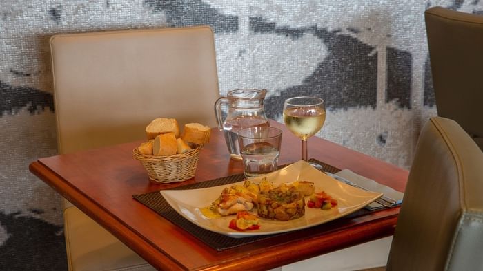 Closeup of Meals served with wine at Gapotel