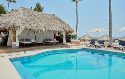Outdoor pool area with loungers at Villa Premiere Boutique Hotel & Romantic Getaway