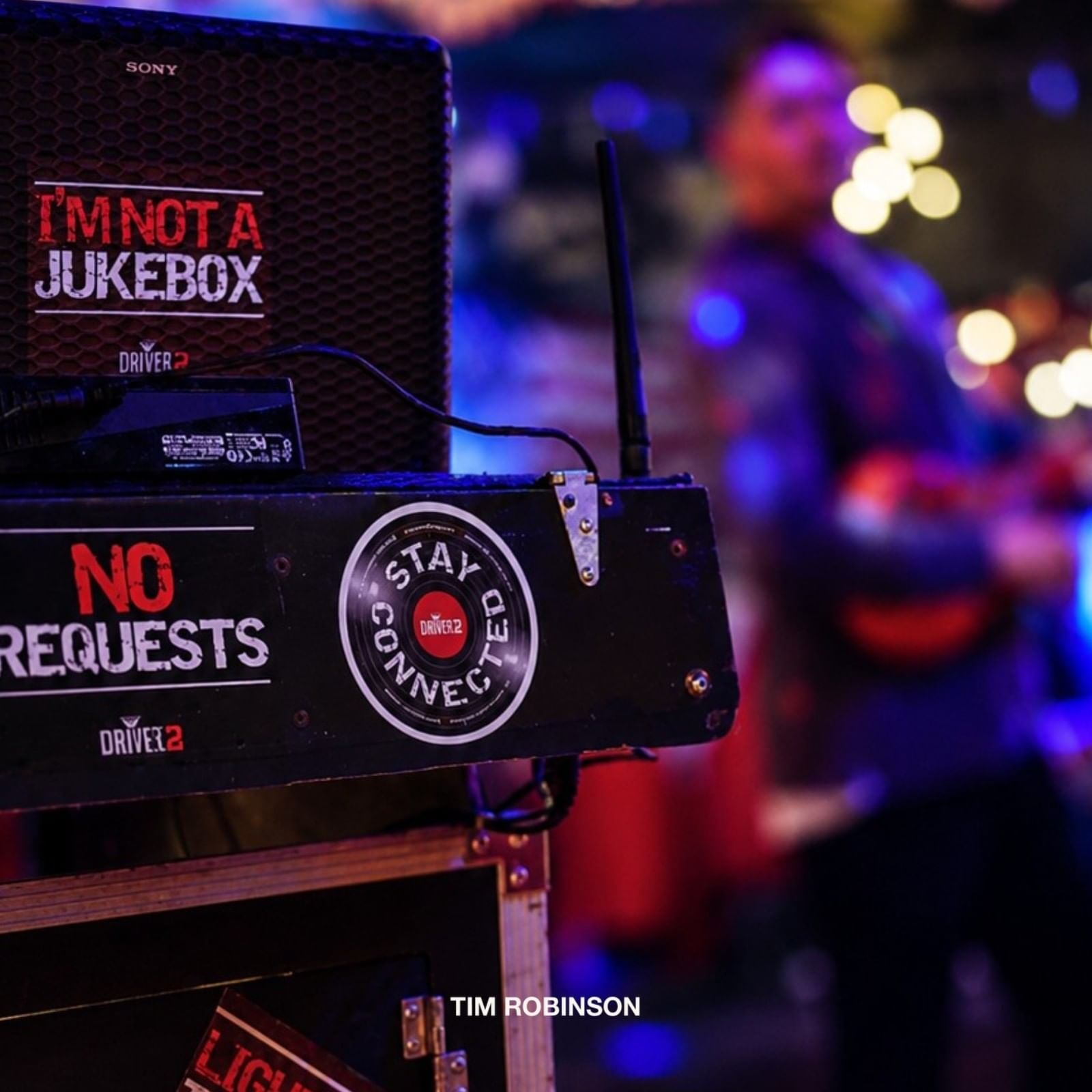 Tim Robinson stage audio equipment with stickers and speaker box set up for concert at Shangri-La Resort and Golf Club