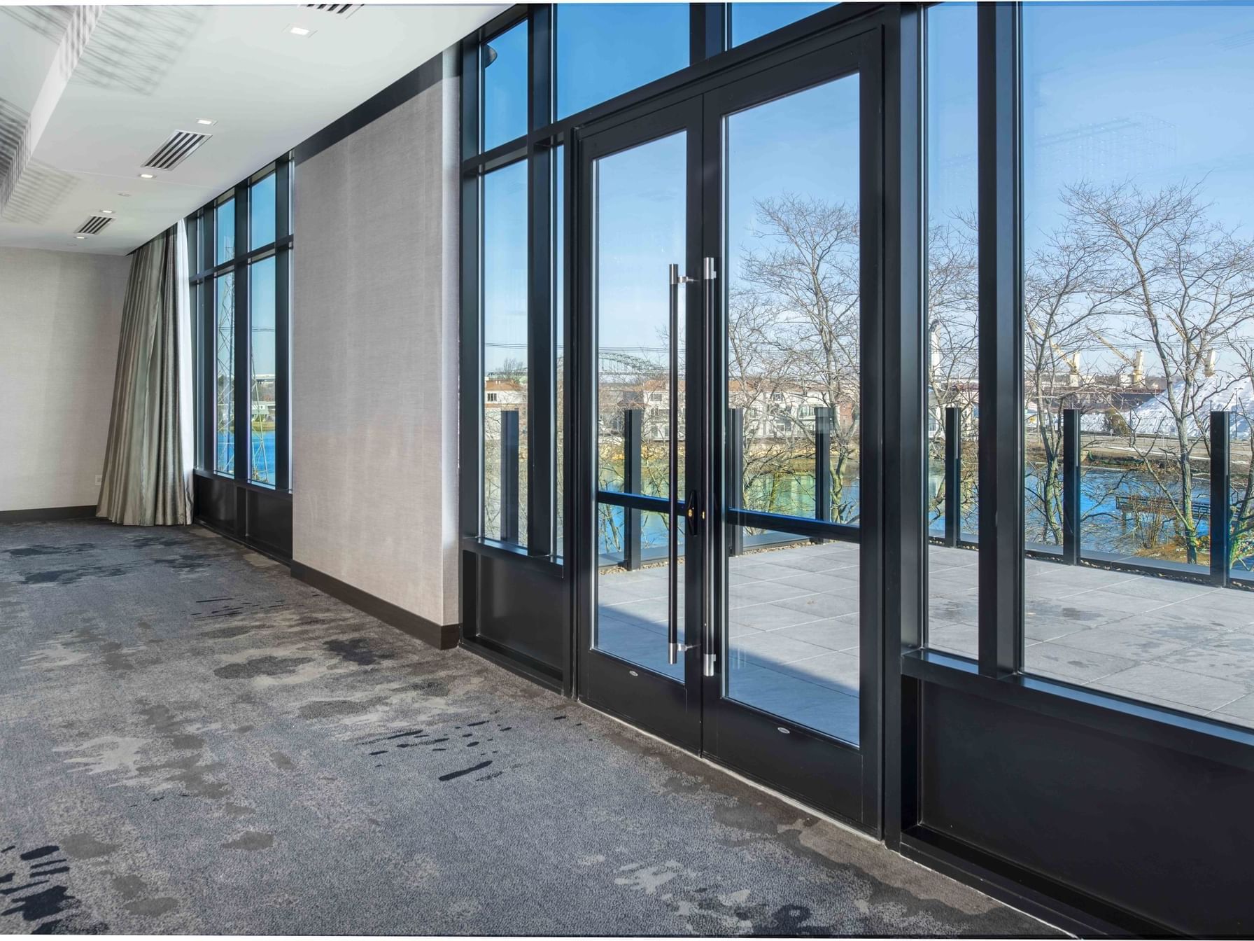 ballroom with door that leads to outside terrace