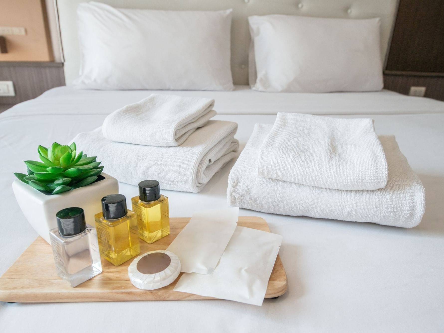 Toiletries and towels on bed at Daydream Island Resort