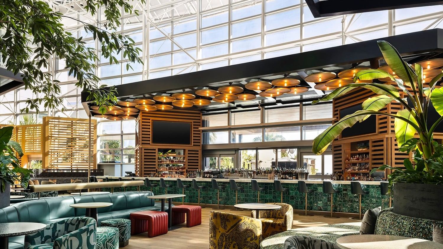 Stylish lobby lounge with plush seating and contemporary bar design.