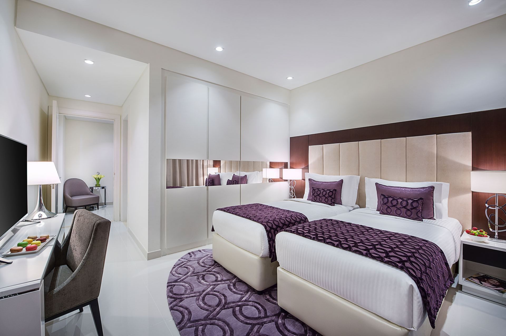 Twin beds by the wardrobe & a work desk space in Two Bedroom Suite at DAMAC Maison Distinction