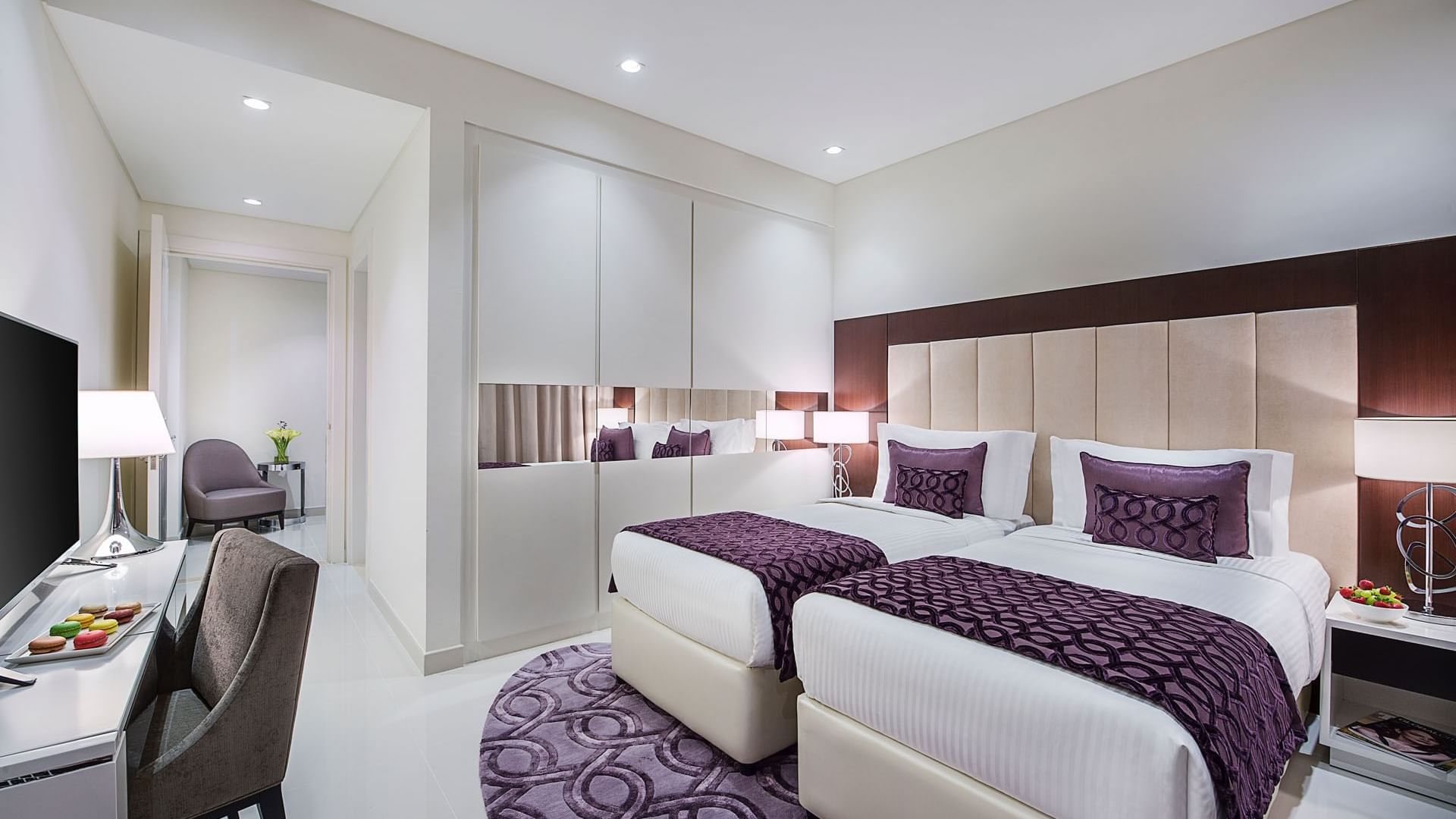 Twin beds by the wardrobe & a work desk space in Two Bedroom Suite at DAMAC Maison Distinction