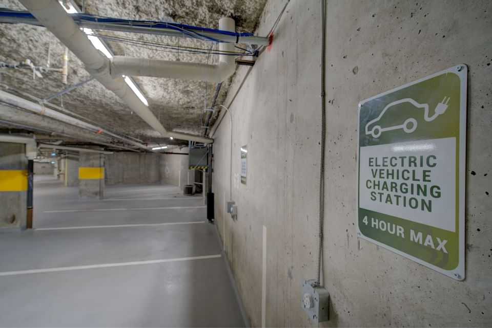 parking lot with sign that says electric vehicle charging statio