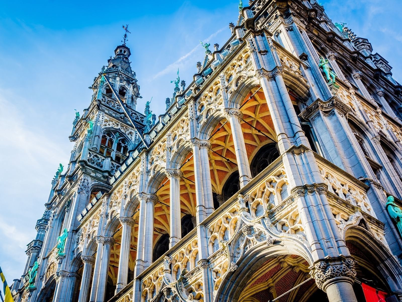 Grand Place, gothic architectural details with stone pillars and arches near Warwick Grand Place Brussels