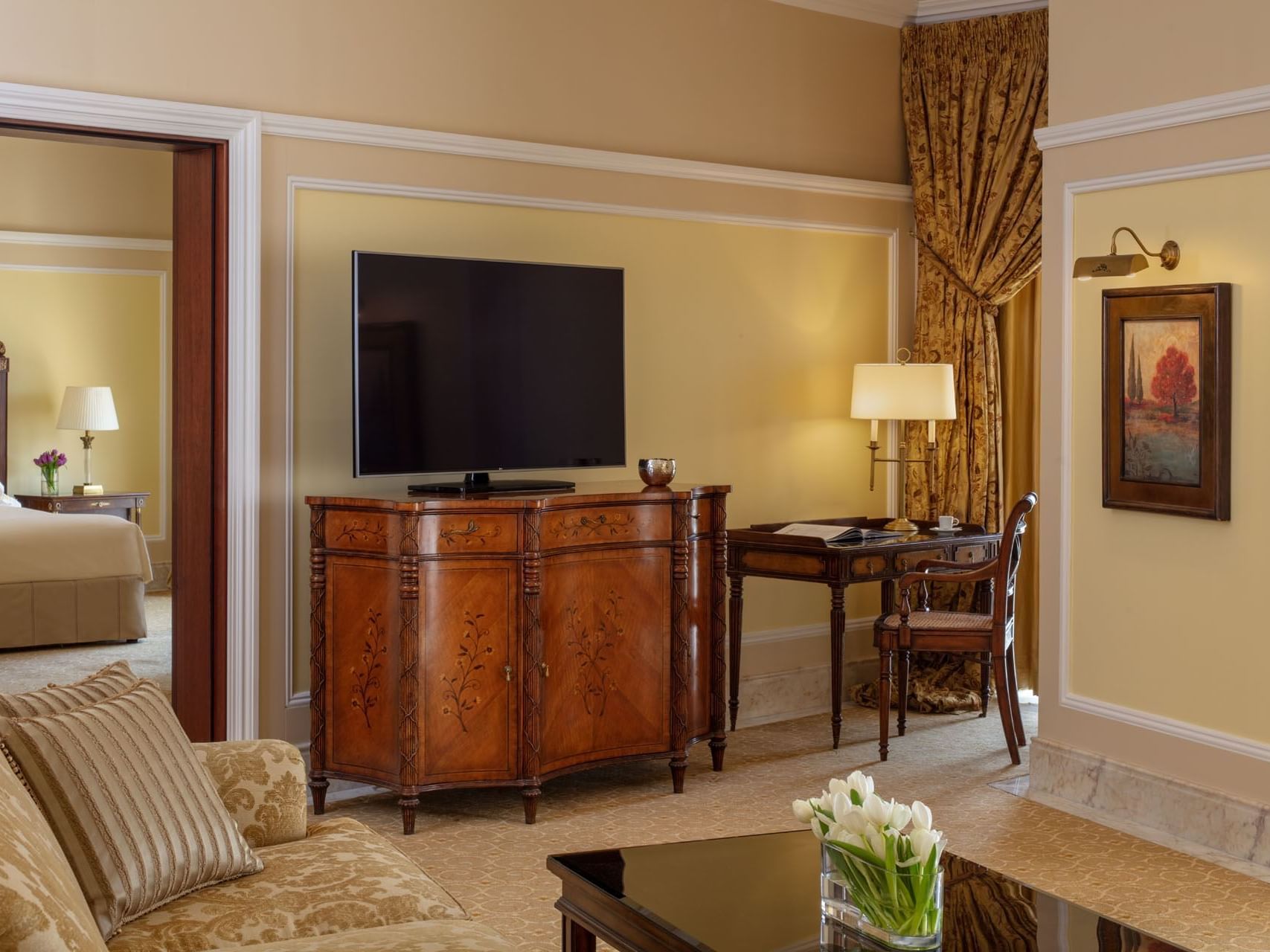 TV, sofa & a work desk in Grand Family Suite, The Regency Hotel