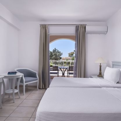 Bedroom & terrace in Standard Family Room at Sandy Beach Resort