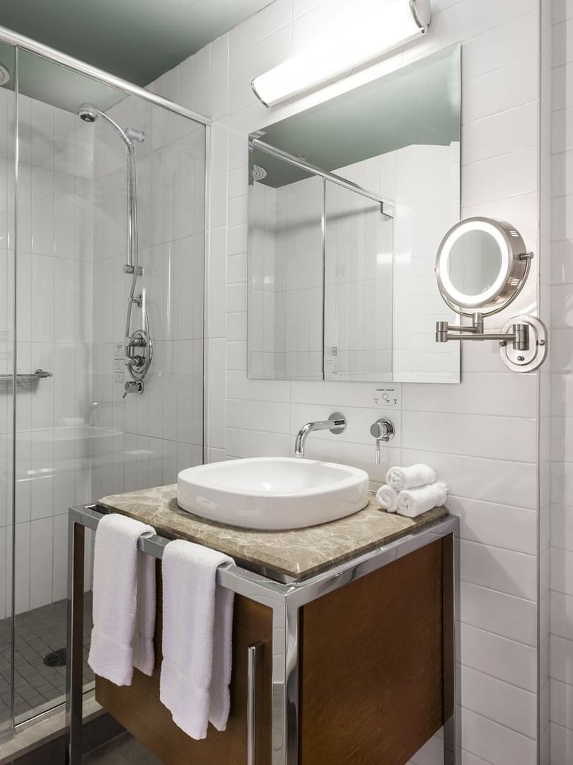 Bathroom with vanity area and shower in Loft 2 king Beds at Warwick Le Crystal Montreal