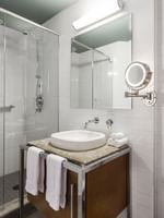 Bathroom with vanity area and shower in Loft 2 king Beds at Warwick Le Crystal Montreal