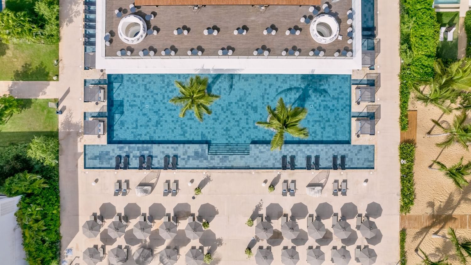 Drone shot of the hotel exterior & pool area at Live Aqua Punta Cana