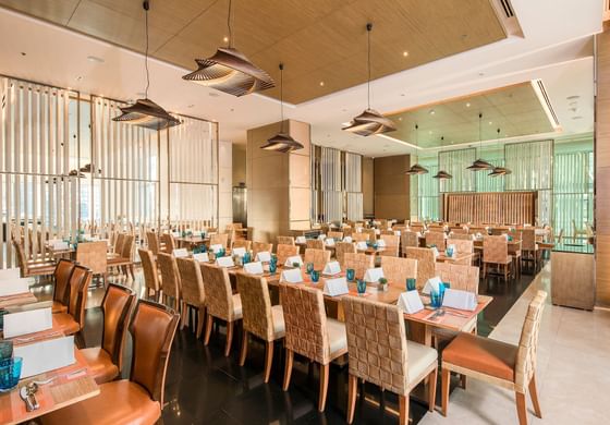 Well-arranged elegant dining area with lights at Eastin Grand Hotel Sathorn