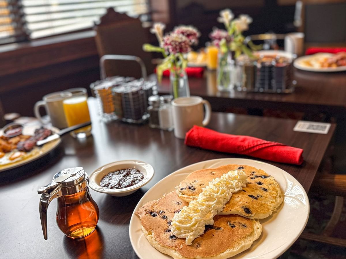 Plates of pancakes and side dishes at Winston's Resto-Bar.