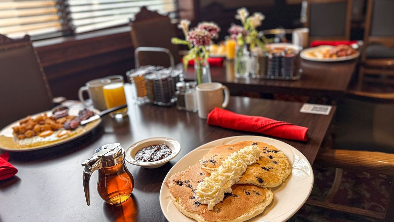 Plates of pancakes and side dishes at Winston's Resto-Bar.