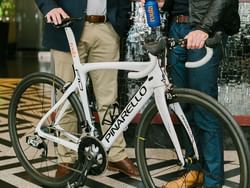 Two men holding a bicycle near the ArtHouse Hotel New York City