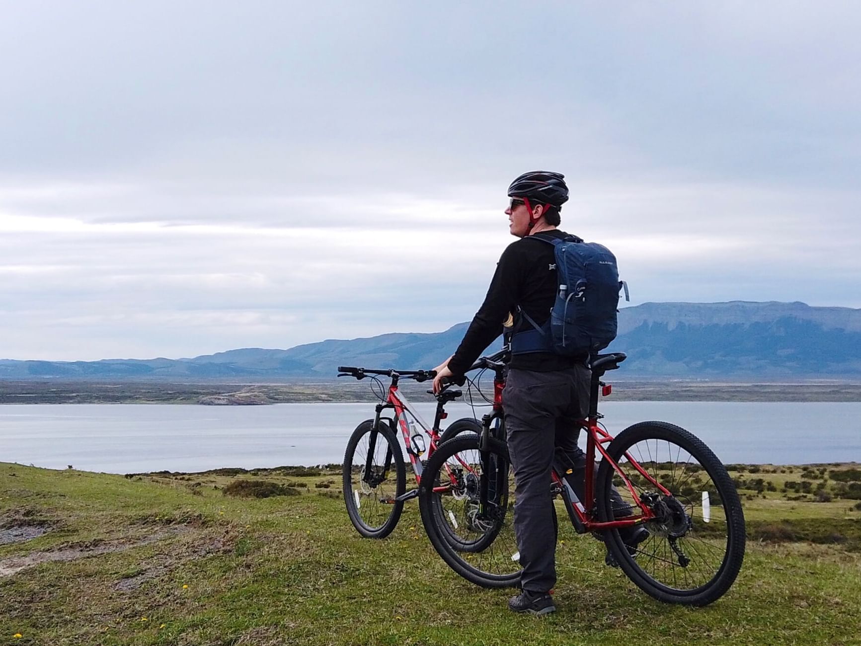 A man on a bike near The Singular Patagonia