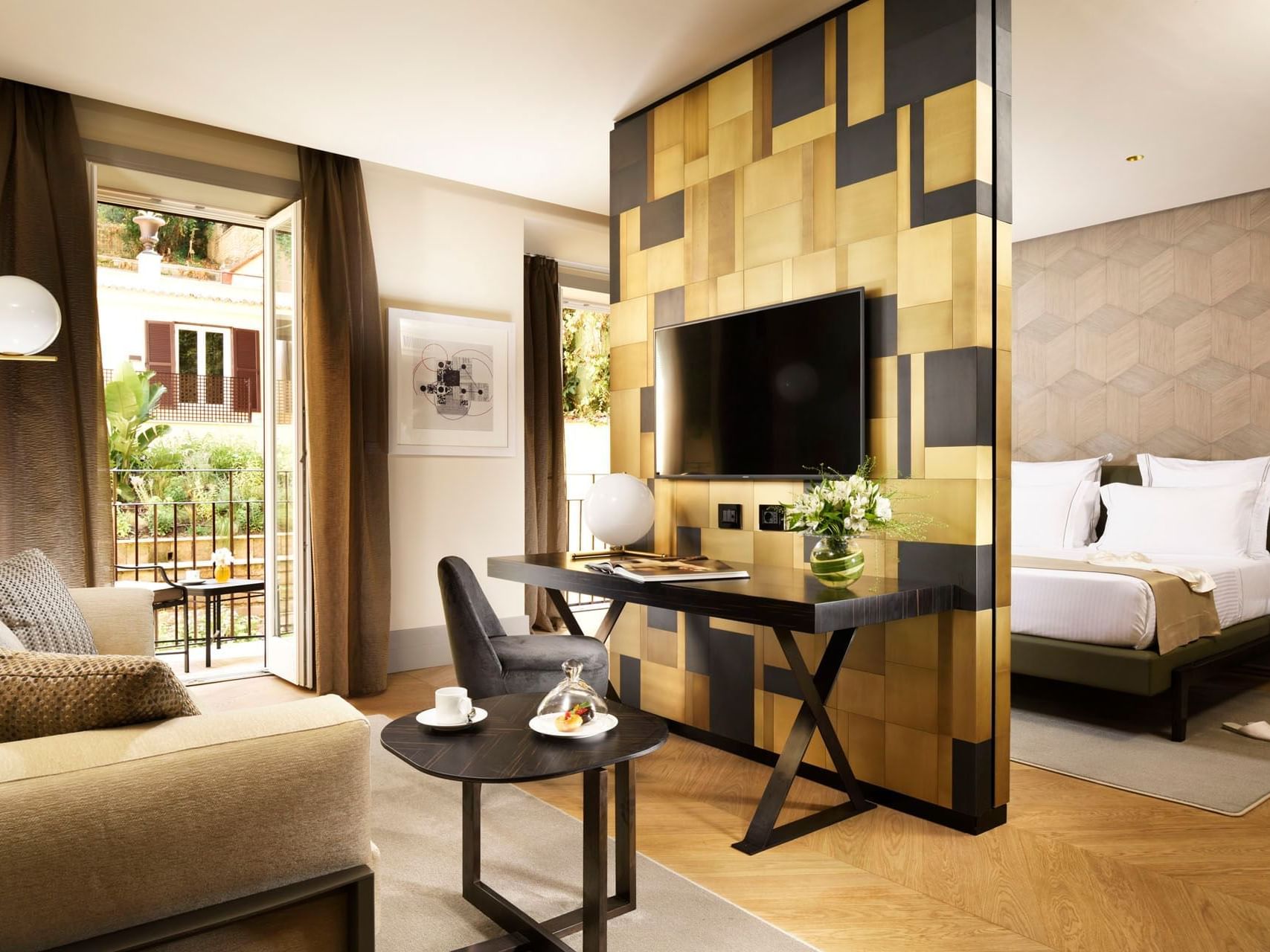 Separated bedroom and living areas with balcony view in Deluxe Suite at Margutta 19