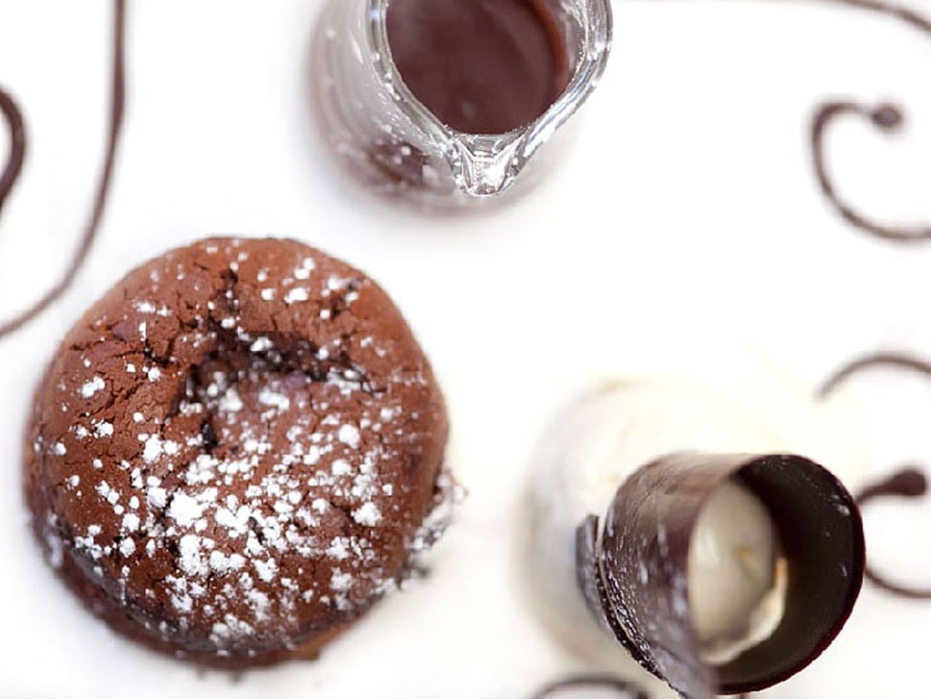 Delicious chocolate dessert, served with ice cream and rich chocolate sauce at Tudors Restaurant, Marygreen Manor