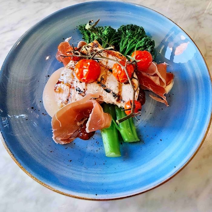 chicken dinner dish on nice blue plate