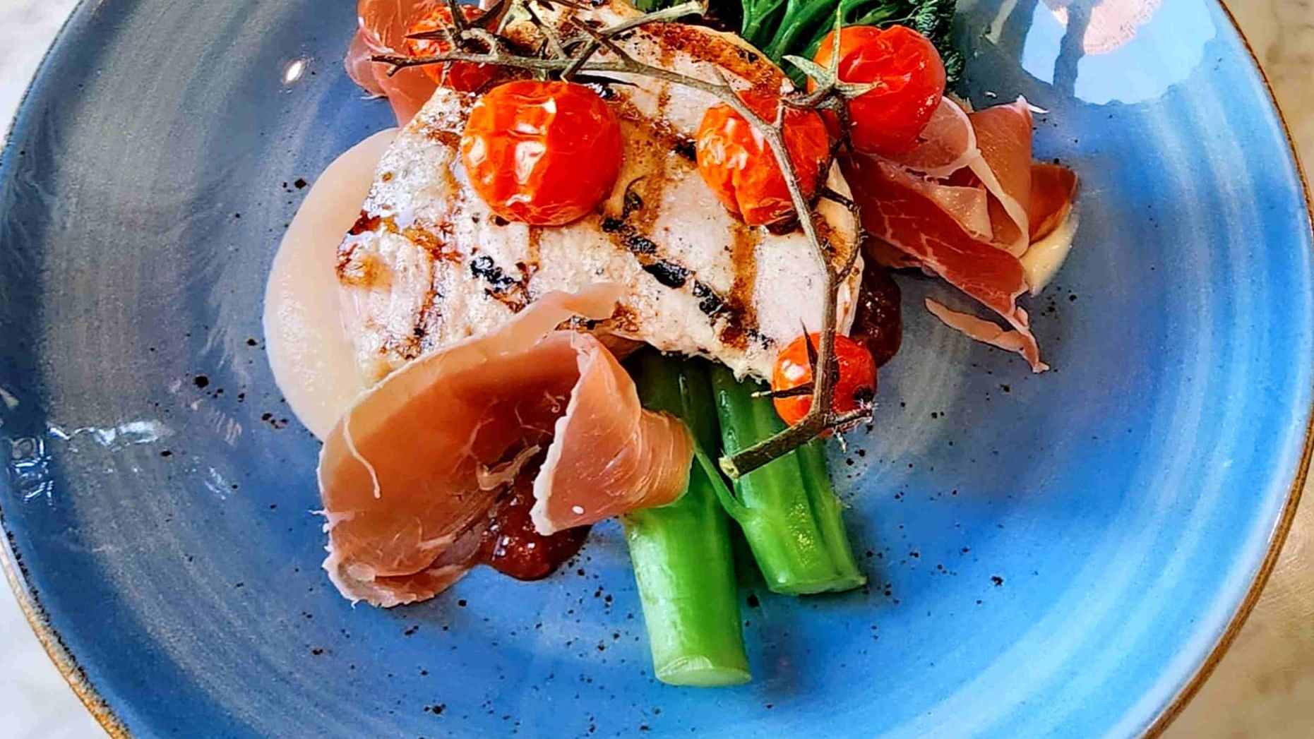 chicken dinner dish on nice blue plate