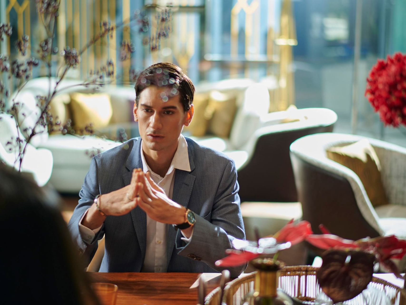 Man waiting in Lobby lounge at Chatrium Hotels & Residences