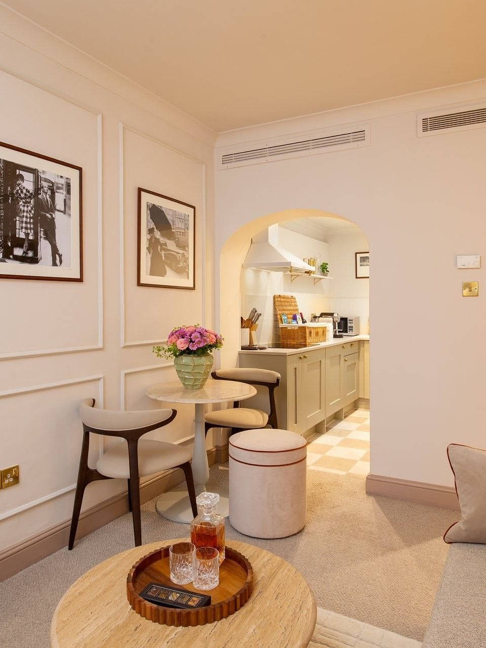 One Bedroom Apartment living with sofa & a dining table near the kitchenette at The Capital Hotel, Apartments and Townhouse