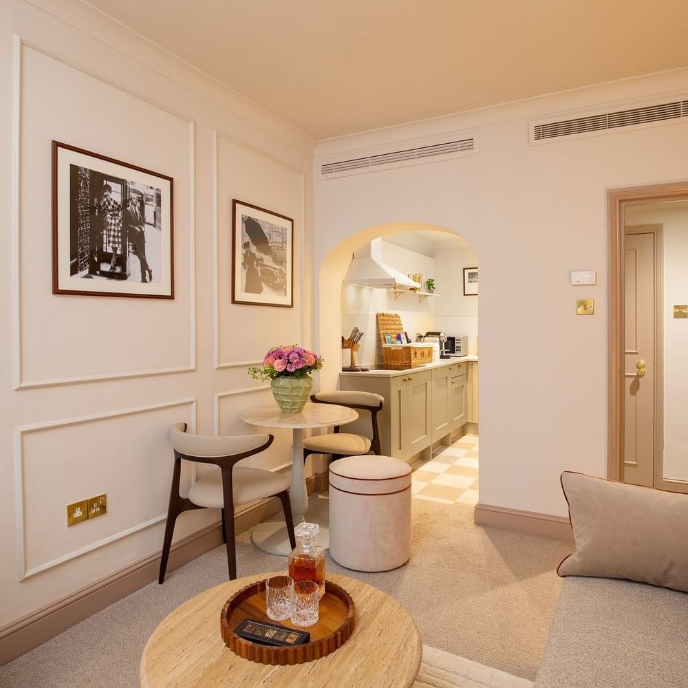 One Bedroom Apartment living with sofa & a dining table near the kitchenette at The Capital Hotel, Apartments and Townhouse