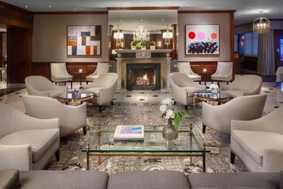 Fireplace & sofas in the lobby at The Townsend Hotel